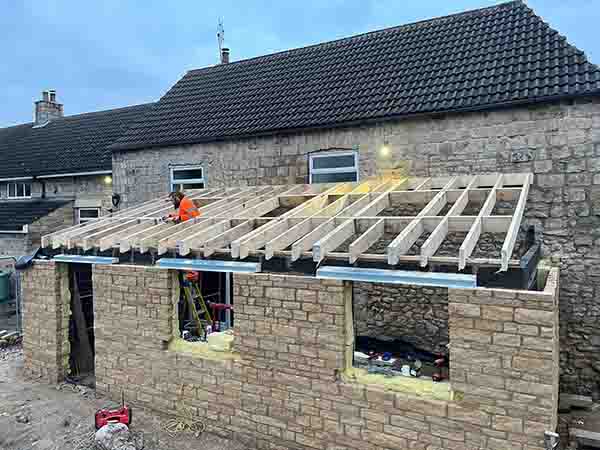 Home extension being built on side of house