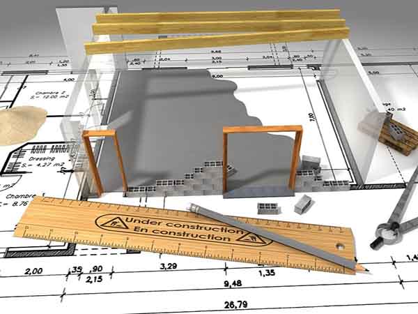 Custom Home Builder - drawing plans for custom home with plans ruler and bricks