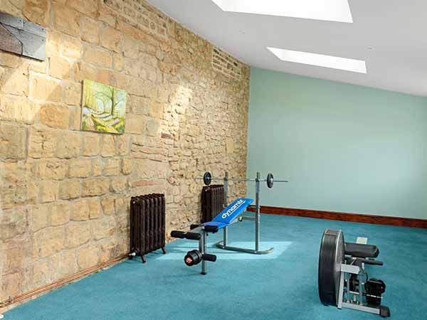 Home gym in custom built home after efficient budgeting